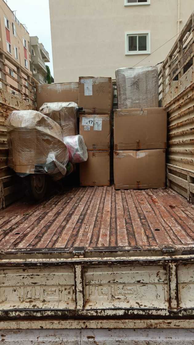 Boxes and wrapped items in the rear of a truck