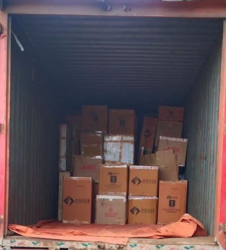 Dedicated closed container truck interior loaded with heavy-duty cartons for Chennai to Hosur house shifting